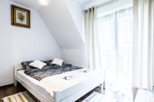 Posteľ alebo postele v izbe v ubytovaní Apartamenty "Zielony Zakątek" Olcza Zakopane