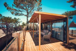a wooden deck with a gazebo at Charm Nature in Azoia