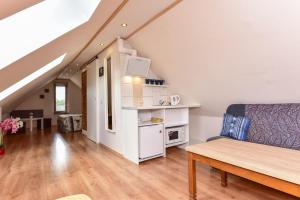 a living room with a couch and a table at "Trakaitis" nameliai in Trakai