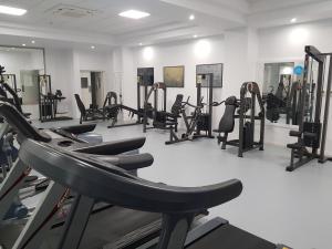 a gym with many tread machines in a room at Nissiana Hotel & Bungalows in Ayia Napa