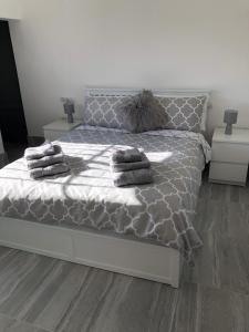 a bedroom with a bed with two pillows on it at Casa Olivia villa in Arboleas