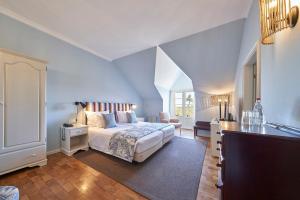 a bedroom with a bed and a desk in a room at Hotel Quinta Do Furao in Santana