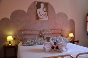 Postel nebo postele na pokoji v ubytování B&B Villa Olmo