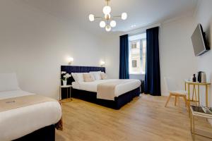 Postel nebo postele na pokoji v ubytování SM Vatican Relais B&B