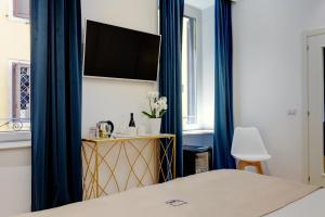 TV a/nebo společenská místnost v ubytování SM Vatican Relais B&B