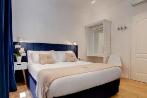 Postel nebo postele na pokoji v ubytování SM Vatican Relais B&B