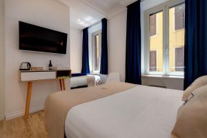 Postel nebo postele na pokoji v ubytování SM Vatican Relais B&B