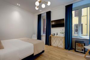Postel nebo postele na pokoji v ubytování SM Vatican Relais B&B