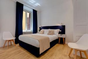 Postel nebo postele na pokoji v ubytování SM Vatican Relais B&B