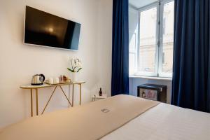 Postel nebo postele na pokoji v ubytování SM Vatican Relais B&B