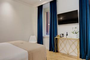 TV a/nebo společenská místnost v ubytování SM Vatican Relais B&B