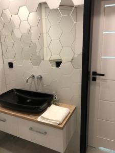 Kúpeľňa v ubytovaní Apartament Łeba Kosciuszki Centrum