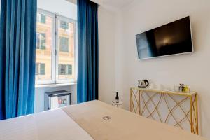 TV a/nebo společenská místnost v ubytování SM Vatican Relais B&B