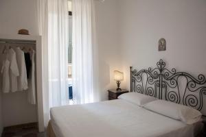 Postel nebo postele na pokoji v ubytování Il Palazzetto