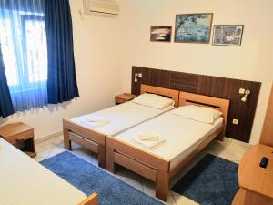 Postel nebo postele na pokoji v ubytování Guesthouse Villa Paškal