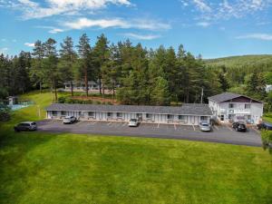 an aerial view of a building with a parking lot at Fair Isle Motel in Whycocomagh