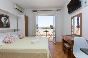 Postel nebo postele na pokoji v ubytování Apartments Ban