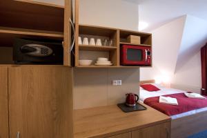 A bed or beds in a room at Vila DEDO