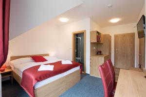 A bed or beds in a room at Vila DEDO