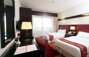 Ein Bett oder Betten in einem Zimmer der Unterkunft Golden Park Hotel Cairo, Heliopolis