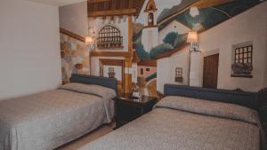Postel nebo postele na pokoji v ubytování Hotel Aurora