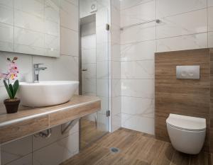 a bathroom with a sink and a toilet at Vasiliki House in Sarti