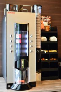 a coffee machine sitting on a counter with food at Belken Hotel Kanda in Tokyo