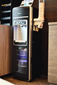 a refrigerator with its door open in a kitchen at Belken Hotel Kanda in Tokyo