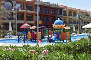 a playground in front of a apartment complex at شاليهات بورتو مطروح فيو بحر Porto Matrouh Sea View Families Only in Marsa Matruh