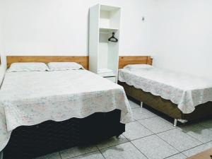 מיטה או מיטות בחדר ב-Apartamento por Temporada em Santarém no Pará