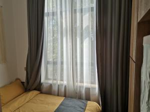 Llit o llits en una habitació de Shenzhen Ruiya Japanese-style Hotel Huaqiang North