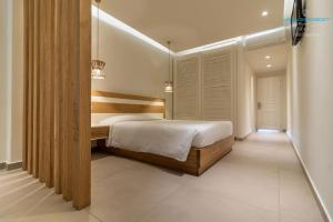 Posteľ alebo postele v izbe v ubytovaní Aeolos Resort