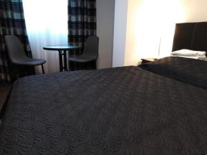 Postel nebo postele na pokoji v ubytování Filsdeger Ház - Central Rooms & Apartmans