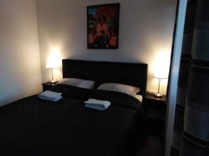 Postel nebo postele na pokoji v ubytování Filsdeger Ház - Central Rooms & Apartmans