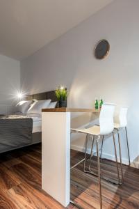 Posteľ alebo postele v izbe v ubytovaní SKY APARTMENTS POZNAŃ