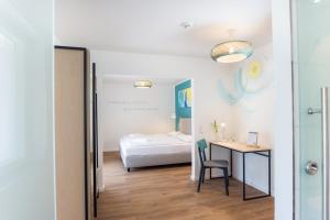 Postel nebo postele na pokoji v ubytování Hotel & Restaurant Mühlenglück