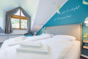 Postel nebo postele na pokoji v ubytování Hotel & Restaurant Mühlenglück