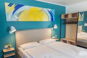 Postel nebo postele na pokoji v ubytování Hotel & Restaurant Mühlenglück