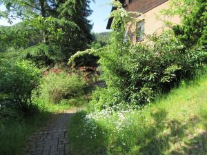 a brick path in front of a house at Ferienwohnung Hammergrund in Mossautal