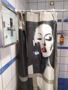 a painting of a woman on a shower curtain at Blue Lagoon Studio in Missolonghi