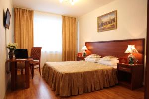 Cama ou camas em um quarto em Olimp park-hotel Kolomna