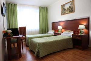 Cama ou camas em um quarto em Olimp park-hotel Kolomna