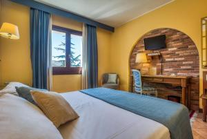 Postel nebo postele na pokoji v ubytování Hotel San Giorgio + 28 fotografií