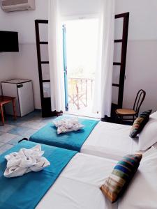מיטה או מיטות בחדר ב-Hotel Boulis