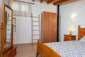 A bed or beds in a room at Can Miquel