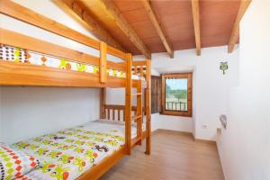 A bed or beds in a room at Can Miquel