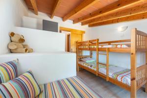 A bed or beds in a room at Can Miquel
