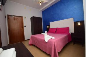 Postel nebo postele na pokoji v ubytování Hotel Como