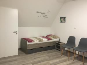 Postel nebo postele na pokoji v ubytování Pension Seeblick Latzko