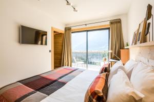 Postel nebo postele na pokoji v ubytování Le Chalet Mont Blanc